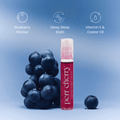 Lip oil with blueberries on a blue background, featuring text about flavor, stain, and ingredients.