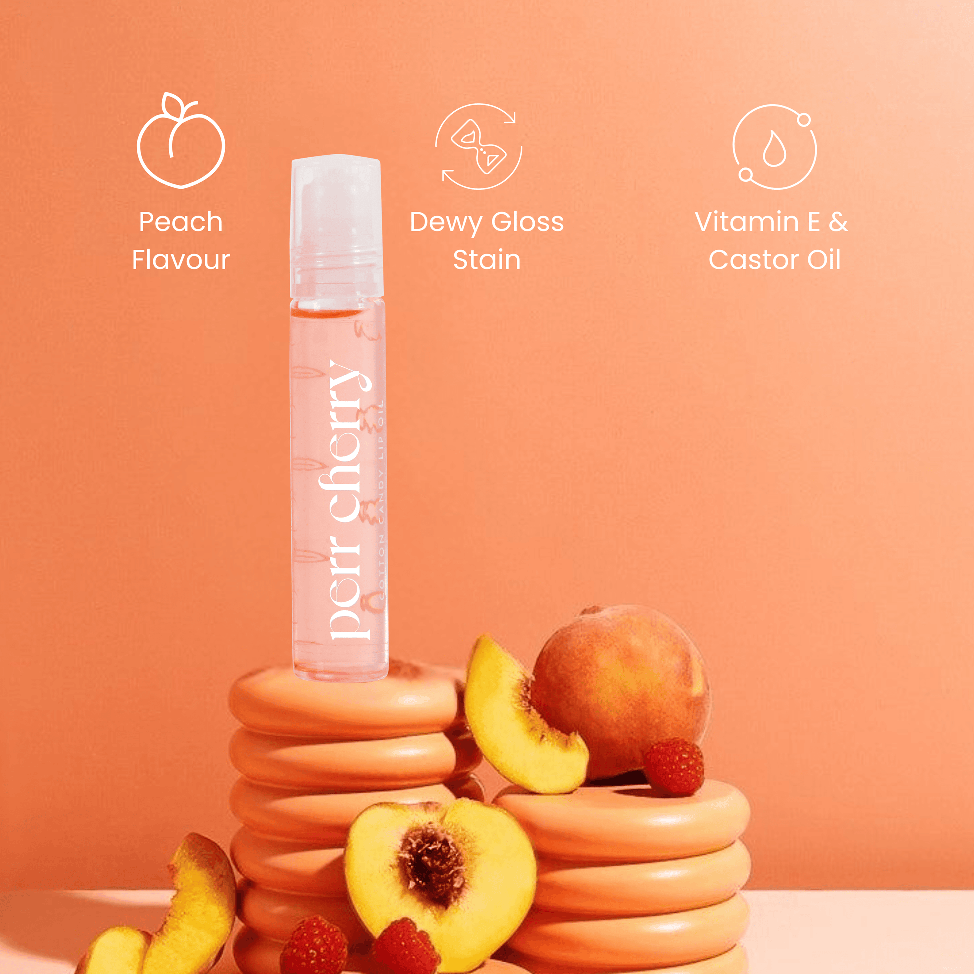 Product bottle with peach flavor, dewy gloss, stain, vitamin E, and castor oil on an orange background.