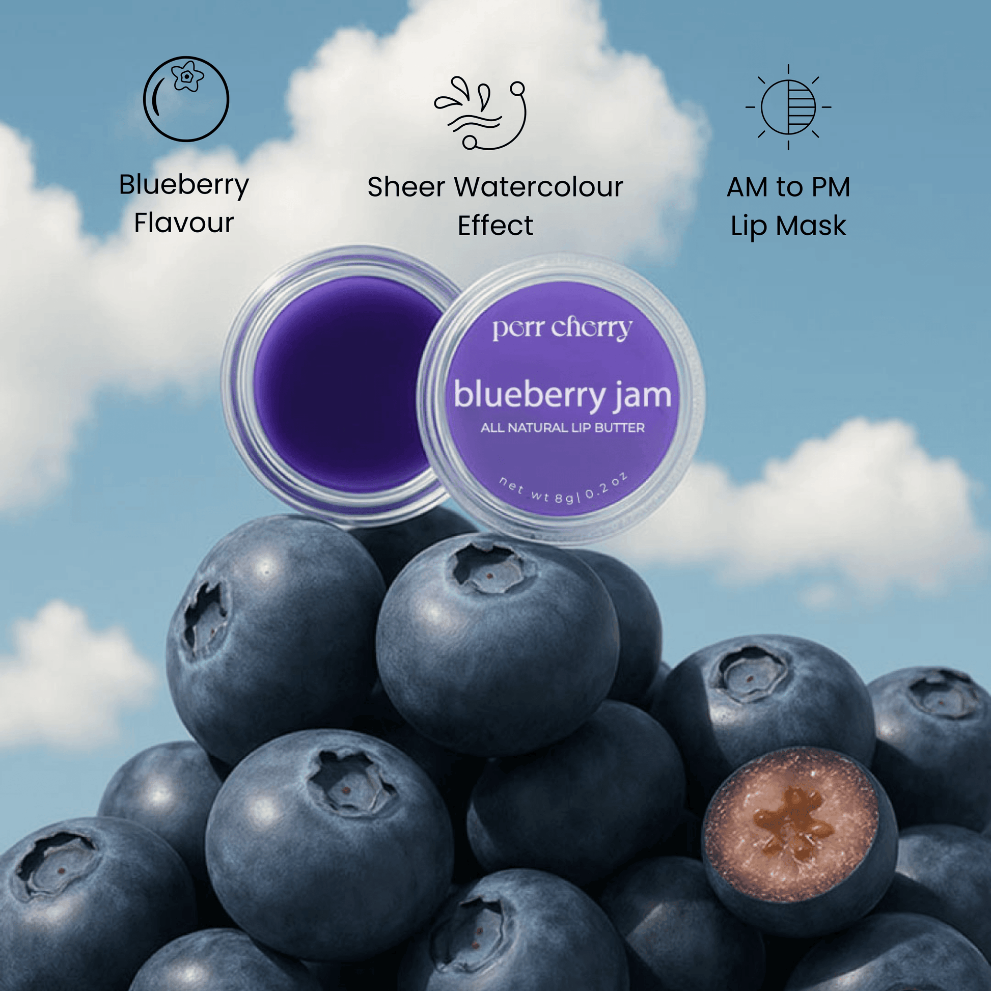 perr cherry blueberry jam lip mask with blueberries against a cloudy sky background