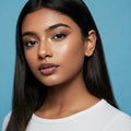 A teen With Skincare and tinted skincare products. 