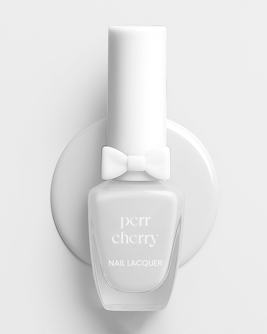 Nail polish bottle with white cap on a light gray background
